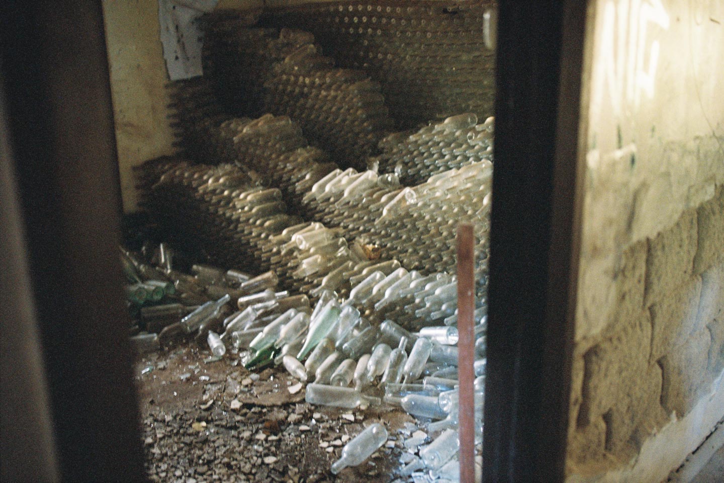 stack of bottles in abandoned gnarabup house